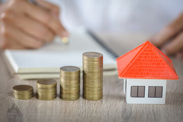 coins money setting growth up increase to house model for concept investment mortgage finance and...