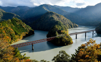 The Oigawa railway station for sightseeing around dam with hidden station during Autumn leaves , in...