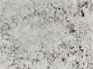 gray concrete texture with rough surface and holes