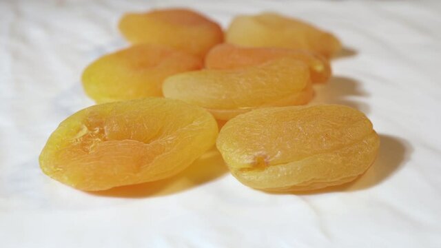 Yellow soft juicy dried apricots close-up