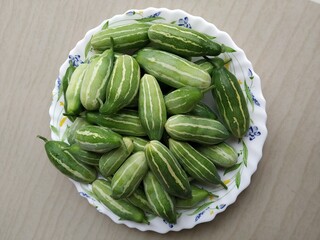 Ivy gourd (Coccinea grandis ) of Cucurbitaceae family in a plate