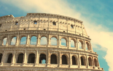 Fototapeta premium Great Colosseum in Rome, Italy, Europe. Roman Coliseum close-up with clear blue sky.