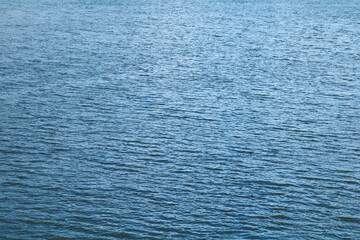 Obraz premium Flat calm blue water surface 