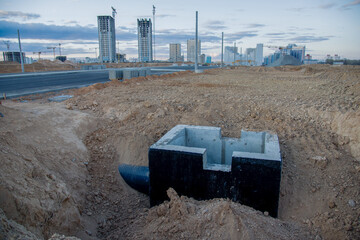 Construction of manhole, stormwater pits, sanitary sewer system distribution chamber and pump...
