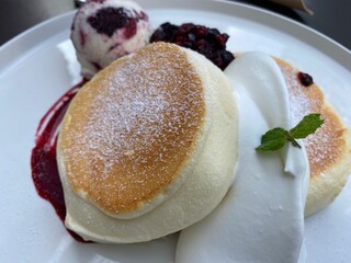 pancake and ice cream on the white plate