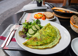 Green spinach omelet with salad, healthy food
