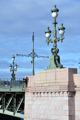 Fototapeta na wymiar Vintage style street lights on the Trinity bridge. Saint-Petersburg, Russia.