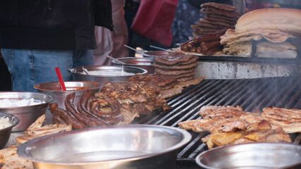 Grilling various types of meat.