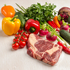Marbled beef steak with vegetables. Raw meat. Organic food.