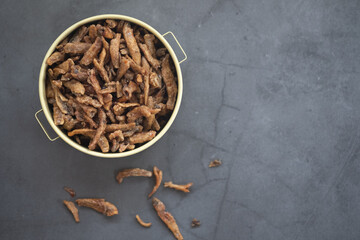 Fried crispy small fish put in tiffin carrier. Thai style appetizer or snack