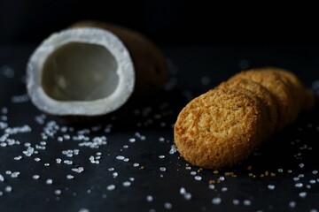 Coconut Cookies with dark background and dried coconut