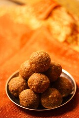 Ladoo, Traditional Indian sweets made for Diwali and another festive season. made with ingredients like peanuts, semolina, sesame seeds, ghee, clarified butter, jaggery, sugar, and cardamom 