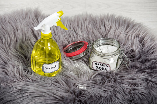 Spray White Vinegar Dilution With Water And Baking Soda (Sodium Bicarbonate) In Glass Jar. Long Hair Fur Carpet Cleaning And Stain Removal, Removing Smell Concept. Natural Home Cleaners.