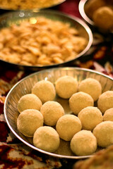 Ladoo, Traditional Indian sweets made for Diwali and another festive season. made with ingredients like peanuts, semolina, sesame seeds, ghee, clarified butter, jaggery, sugar, and cardamom 