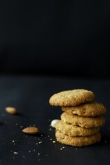 Dry Fruit cookies stacked on each other with almonds and cashews