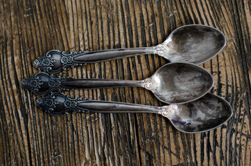 vintage teaspoons on wooden background