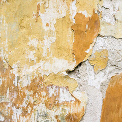A snapshot of the texture of an old concrete wall painted in Sepia. Vintage free background for design placement.