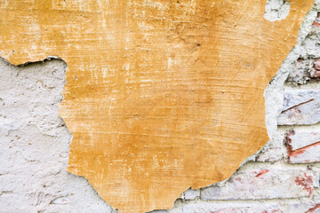 A snapshot of the texture of an old concrete wall painted in Sepia. Vintage free background for design placement.