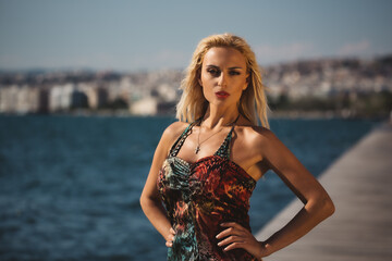 A woman standing next to a body of water