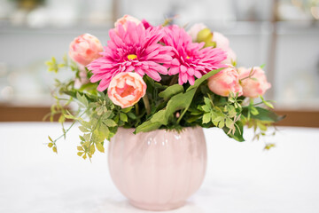 Bouquet of flowers in pink vase