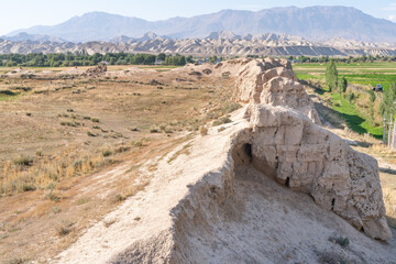 The view of old ancient ruined city Koshoy Korgon and the clay city wall in Kyrgyzstan