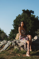 Girl in a dress posing in motion on a street background