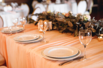 Presidium table setting with empty wine glasses
