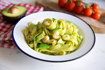 Pasta with avocado cream and shrimps 