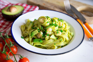 Pasta with avocado cream and shrimps 