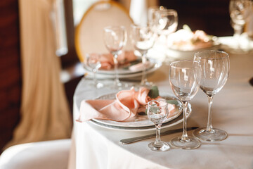 Festive table setting with empty wine glasses