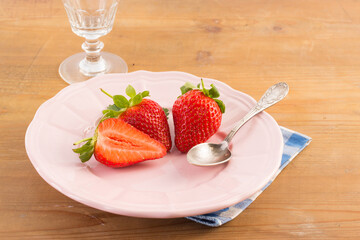 Fresh strawberry  on pink plate