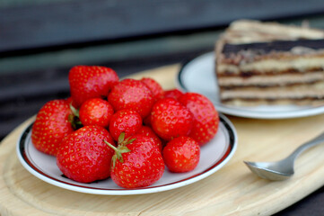 Red strawberries in the palm of your hand