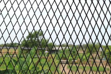 Fototapeta premium The pattern and surface of the black steel mesh.