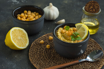 Hummus is a traditional appetizer made from chickpea puree the products it is made from are chickpeas, lemon, garlic and olive oil, horizontal arrangement