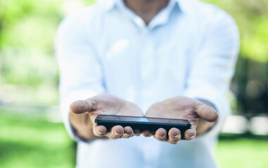 man hand holding smart phone