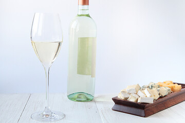 Bottle of white wine and cheese