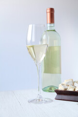Bottle of white wine and cheese