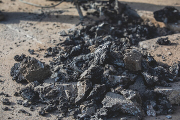 Process of road repairing works with jackhammer, builder worker with  pneumatic hammer and drill equipment breaking asphalt pavement and concrete at construction site