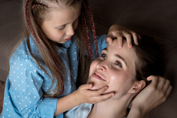 little daughter does mom face massage