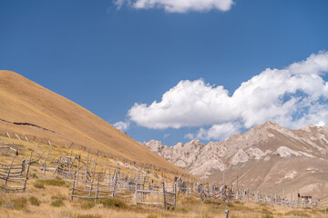 The view of old traditional graveyard in small remote village in Kyrgyzstan