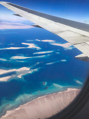 Obraz premium Ariel view of Red Sea which located in Egypt with beauty of nature and landscape from airplane window as travel concept and adventure memory card from vacation mobile photography in winter period