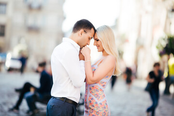 Fototapeta premium Beautiful couple in love dating outdoors and smiling
