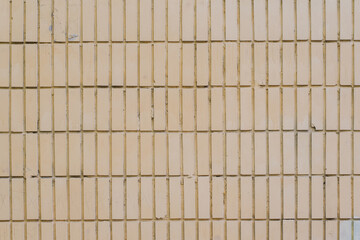 The texture of the walls of smooth brick or smooth tile white and yellow