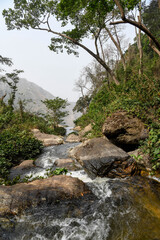 Naklejka na ściany i meble Wli Waterfalls in the middle of the mountains in Ghana.