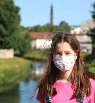 Young pretty girl with surgical mask
