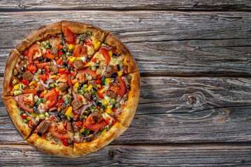 Fresh vegetarian pizza on wooden board