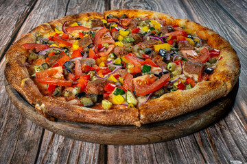 Vegetarian pizza with tomatoes, zucchini, sweet peppers and eggplant 