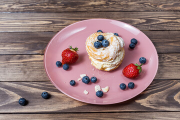 cream cake decorated with berries