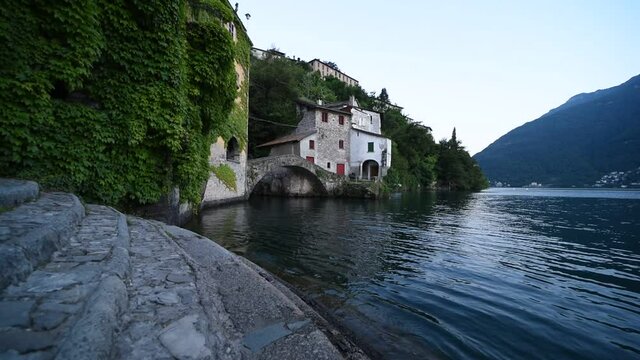 Beautiful calm romantic scenery of Nesso on Como lake in Lombardy northern Italy at the sunset