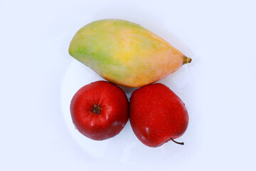 Red apples and mango  isolated on the white background 